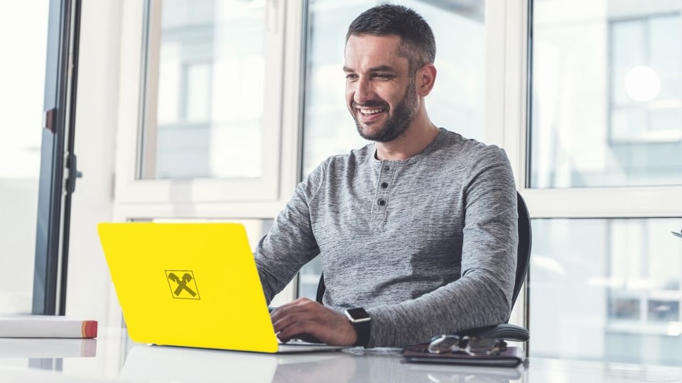 Man working on notebook.